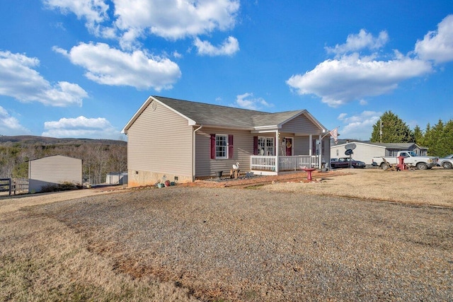 view of front of property with a front yard and covered porch