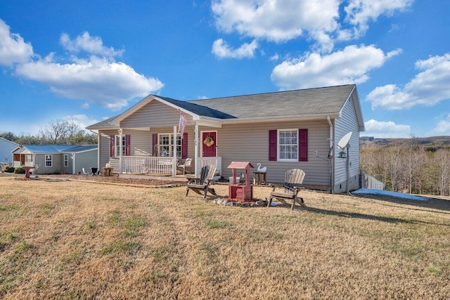 view of front of house with a front lawn and a porch