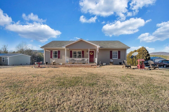 view of front of property featuring a front yard and a porch