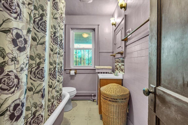 bathroom with toilet and vanity