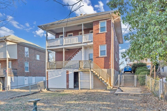 back of property featuring a balcony