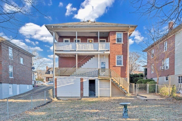 rear view of property featuring a balcony