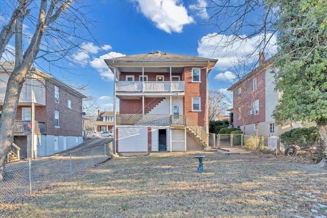 back of property featuring a balcony