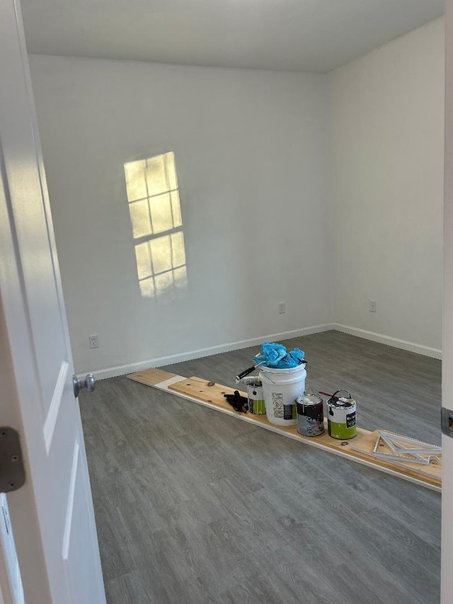 unfurnished room featuring hardwood / wood-style floors