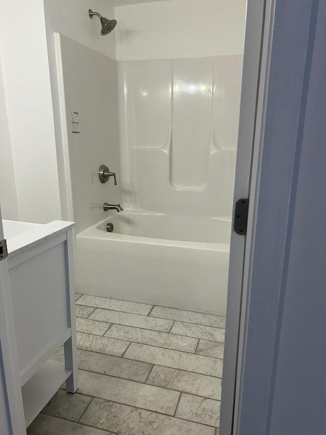 bathroom with shower / bath combination and vanity