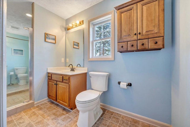 bathroom featuring a shower, a textured ceiling, toilet, and vanity