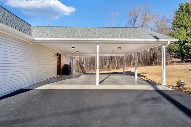 view of car parking featuring a carport