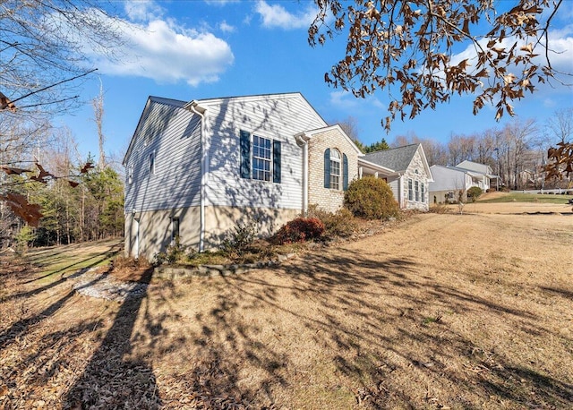 view of home's exterior featuring a lawn