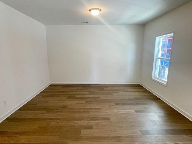 spare room featuring hardwood / wood-style flooring