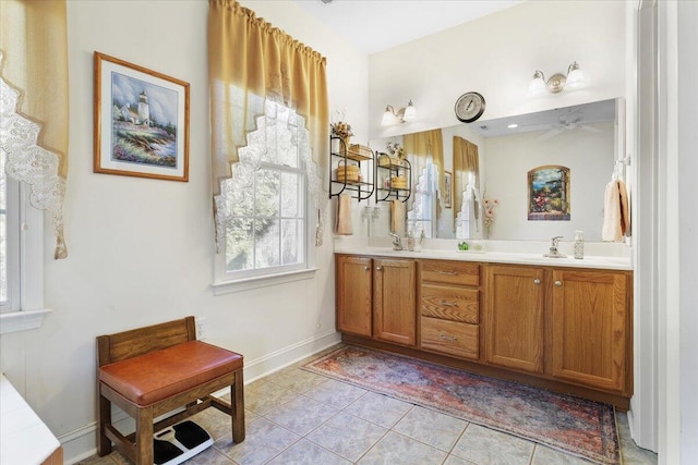 bathroom featuring vanity, tile patterned floors, and ceiling fan