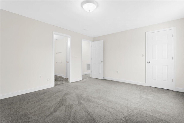 empty room featuring carpet flooring