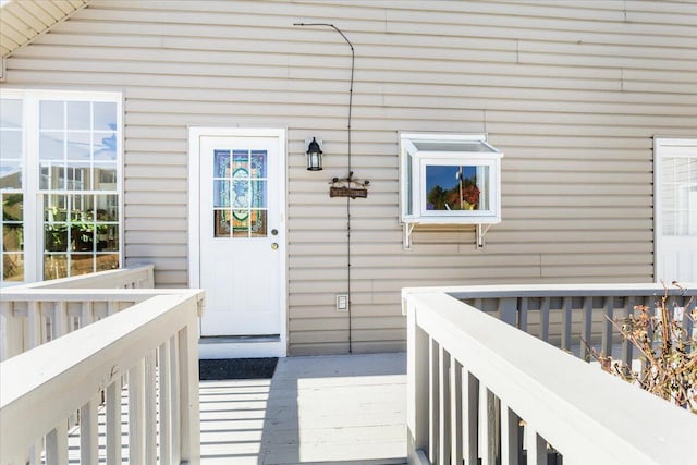 entrance to property featuring a wooden deck