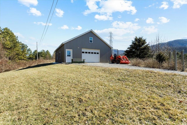 exterior space with a mountain view and a yard