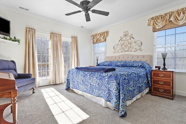 carpeted bedroom featuring crown molding, access to outside, and ceiling fan