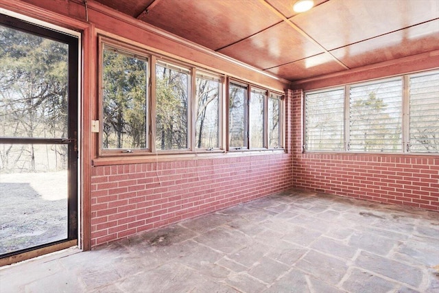 unfurnished sunroom with a wealth of natural light