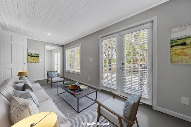 living room with french doors and crown molding