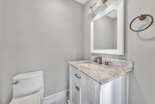 bathroom with vanity and toilet