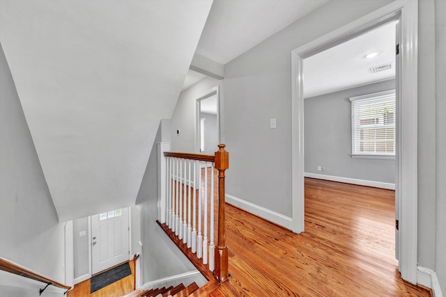 stairs featuring wood-type flooring