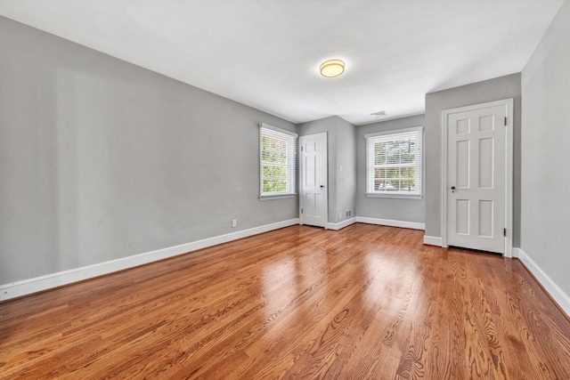 unfurnished bedroom with light wood-type flooring