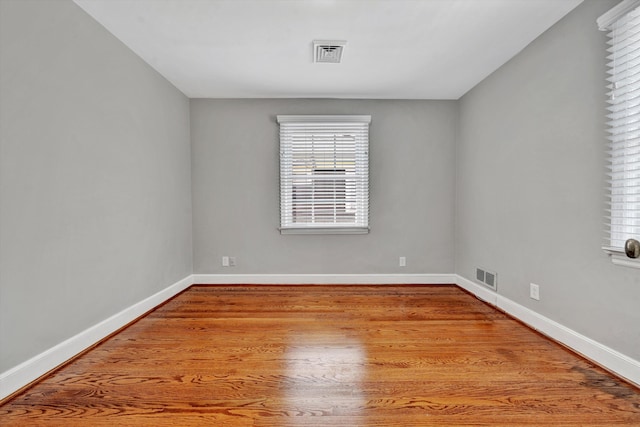 unfurnished room with light hardwood / wood-style flooring