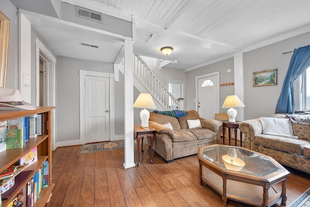 living room featuring ornamental molding and hardwood / wood-style floors