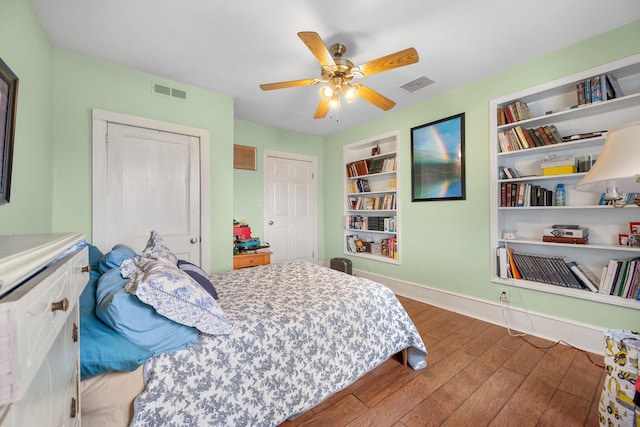 bedroom with ceiling fan and wood-type flooring