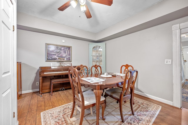 dining room featuring ceiling fan and light hardwood / wood-style flooring