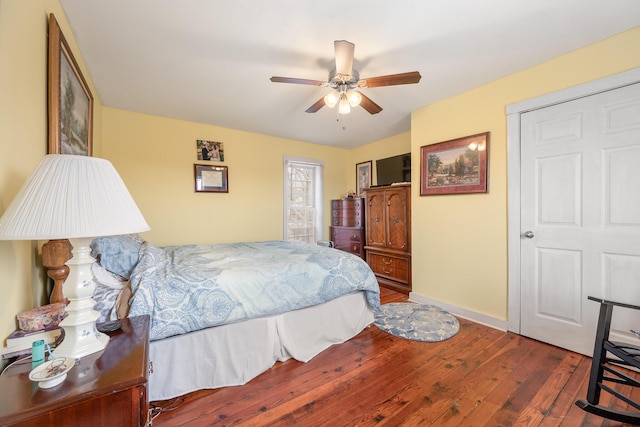 bedroom featuring ceiling fan and dark hardwood / wood-style flooring