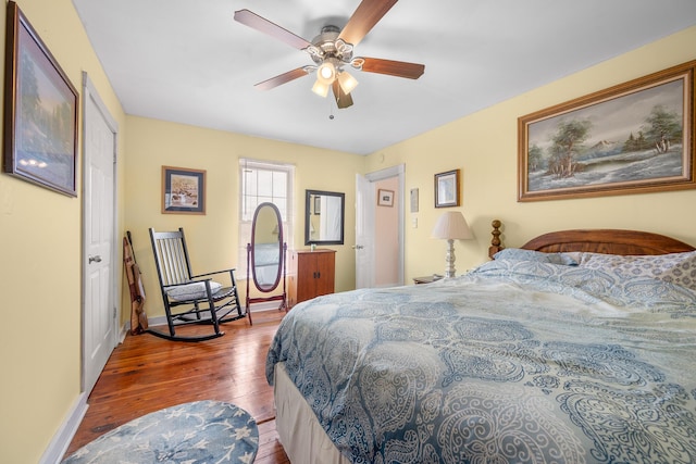 bedroom featuring ceiling fan and wood-type flooring