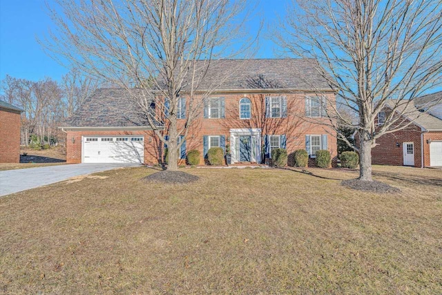 colonial inspired home with a front lawn