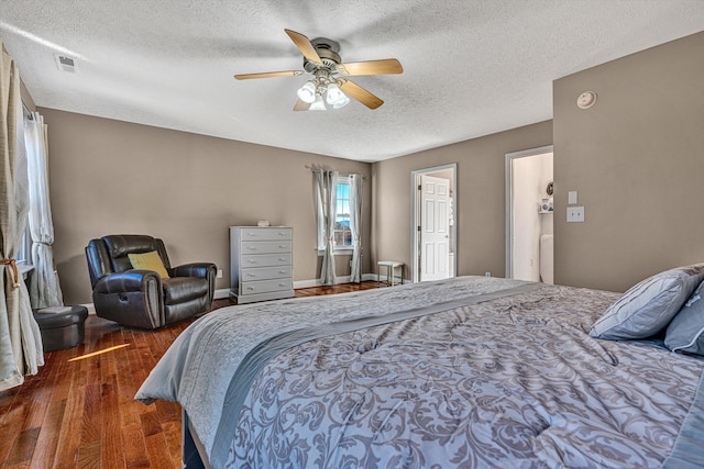 bedroom featuring ceiling fan, a textured ceiling, and dark hardwood / wood-style flooring