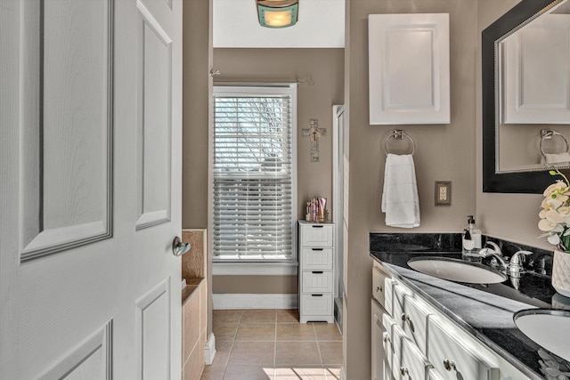 bathroom with tile patterned flooring and vanity