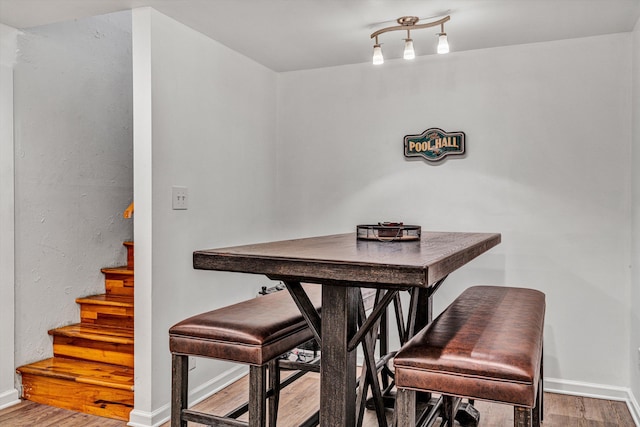 dining space with hardwood / wood-style floors