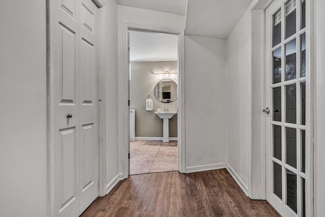 hallway featuring dark hardwood / wood-style flooring