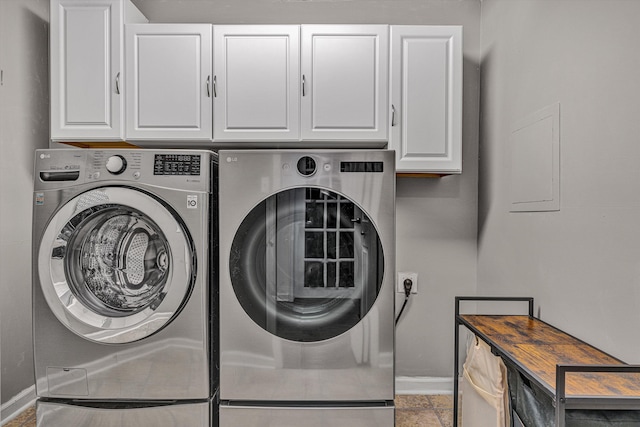 laundry area with cabinets and washer and dryer