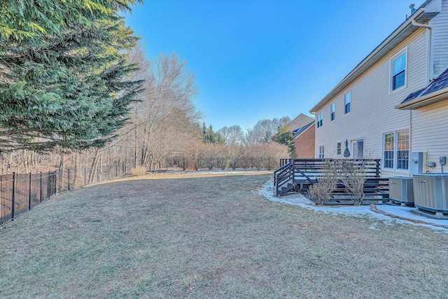 view of yard with a wooden deck and central AC