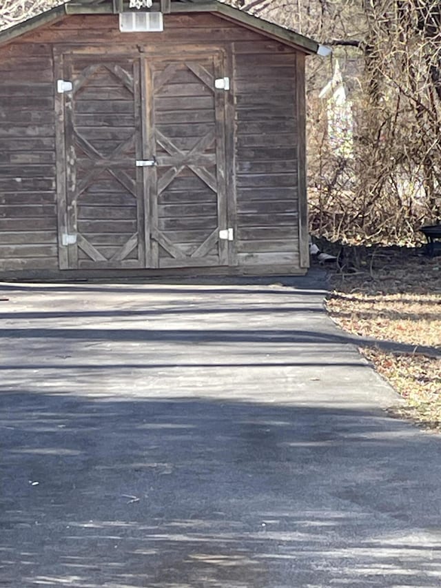 exterior space with a shed