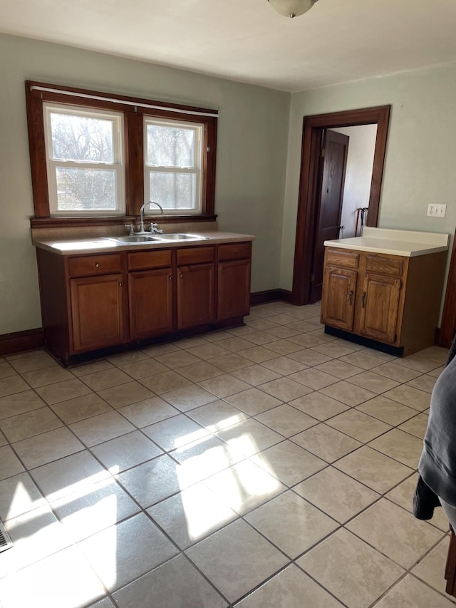 kitchen featuring sink and light tile patterned floors