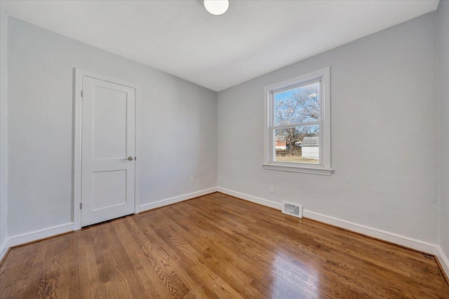 spare room with light wood-type flooring