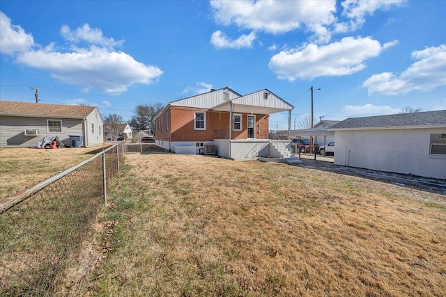 rear view of house with a lawn