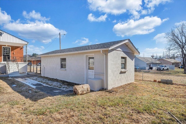 back of property featuring a yard