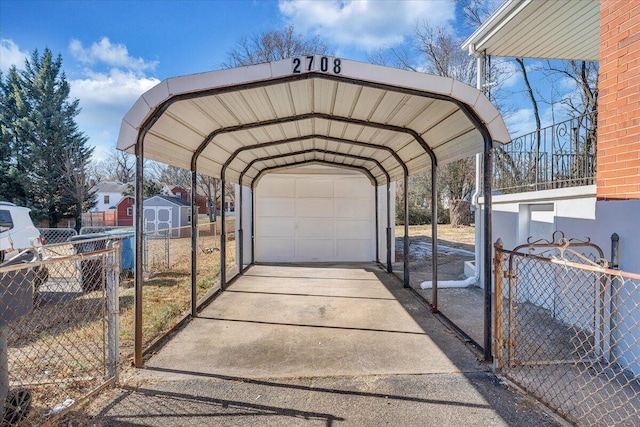 view of parking featuring a carport and a garage