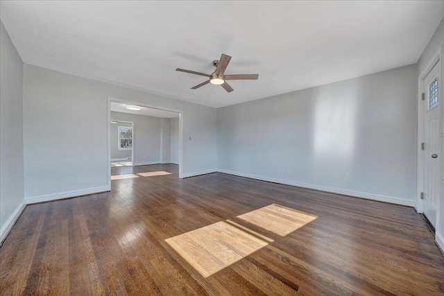 spare room with ceiling fan and dark hardwood / wood-style floors