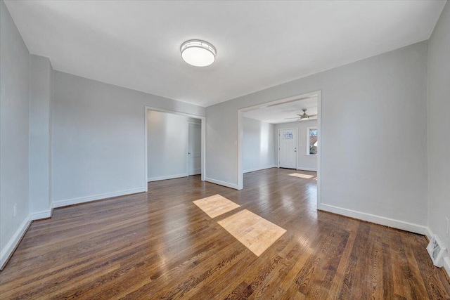 spare room with dark hardwood / wood-style floors