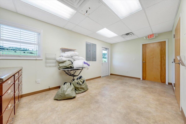 miscellaneous room featuring light carpet and a drop ceiling