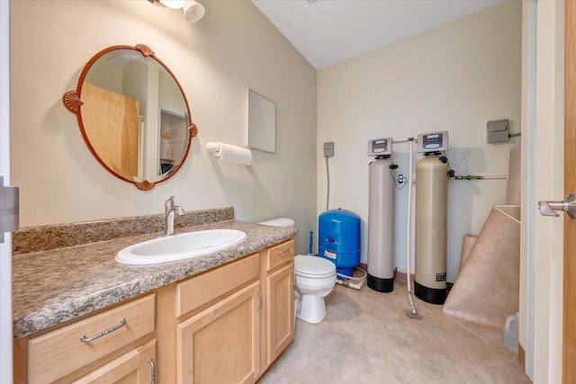 bathroom with toilet and vanity