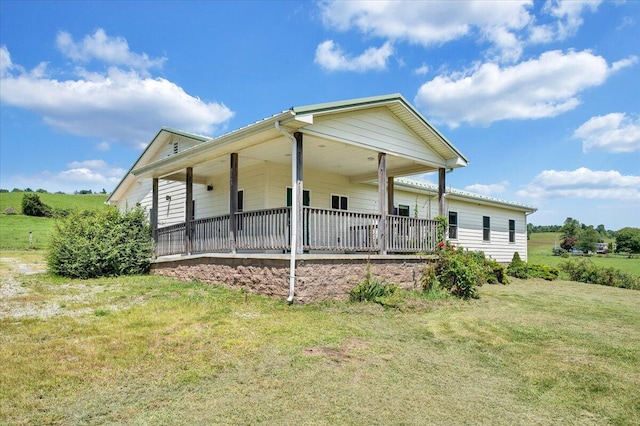 exterior space featuring a porch and a yard