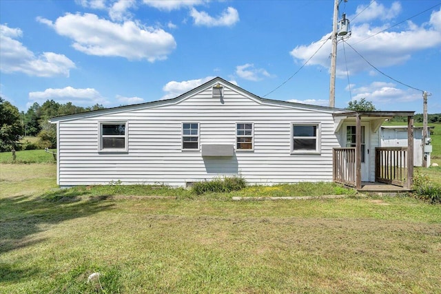 back of house featuring a yard