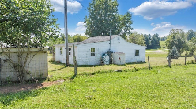 view of home's exterior with a lawn