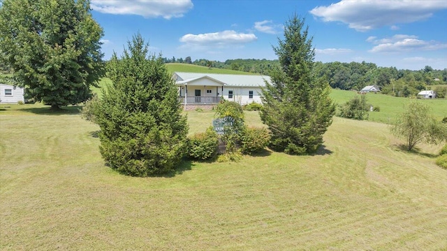 view of yard with covered porch